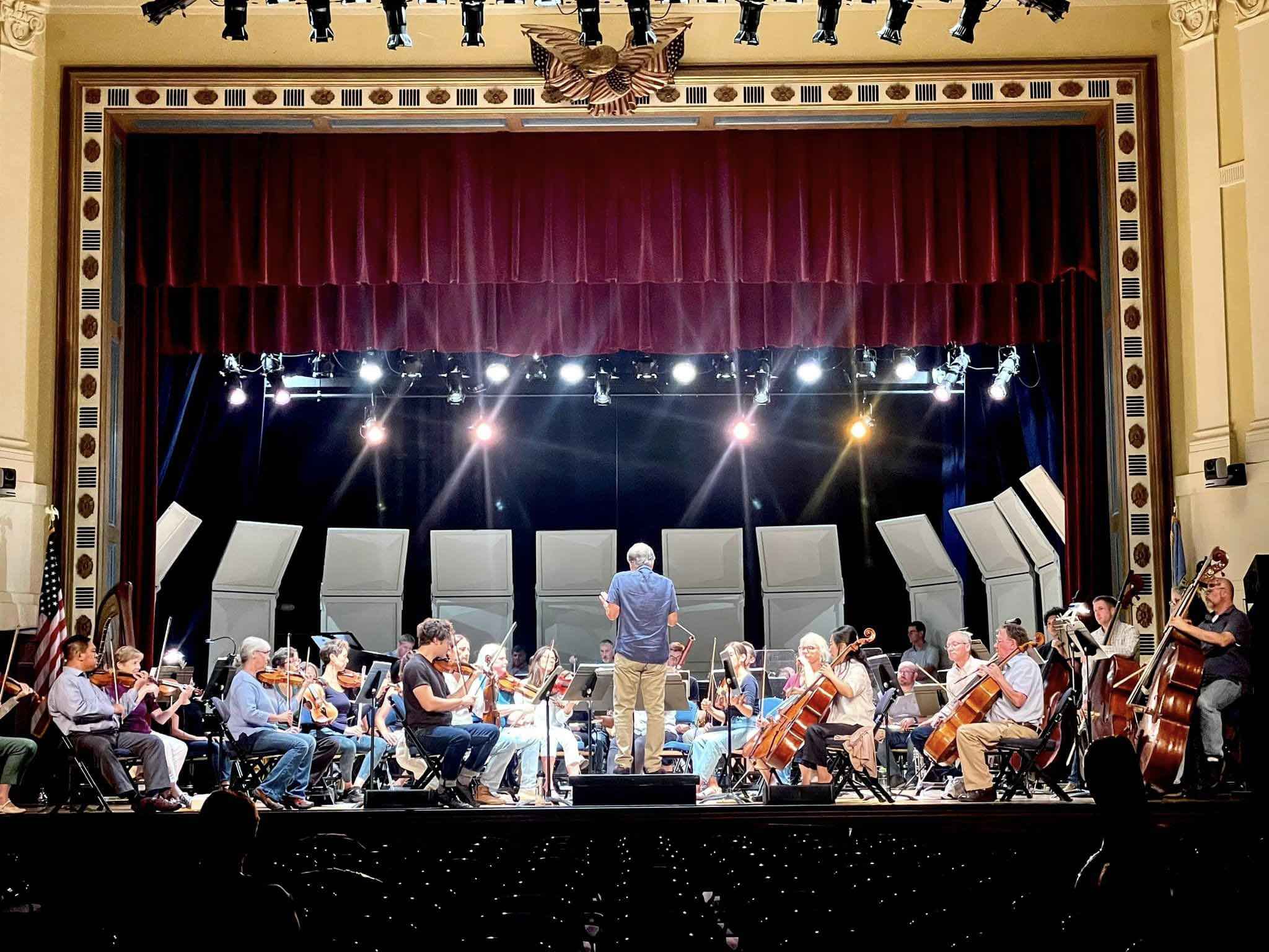 Cary Symphony playing in a music hall.