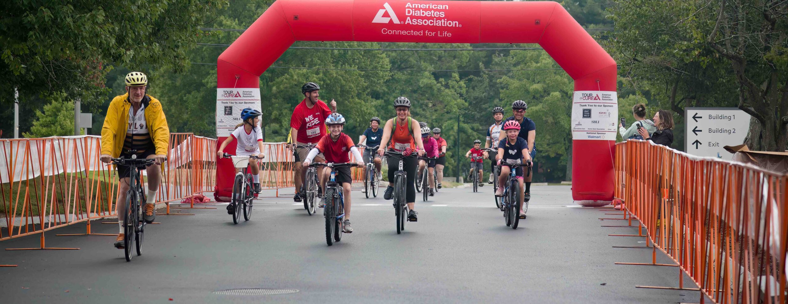 Tour de Cure finishers on bikes.